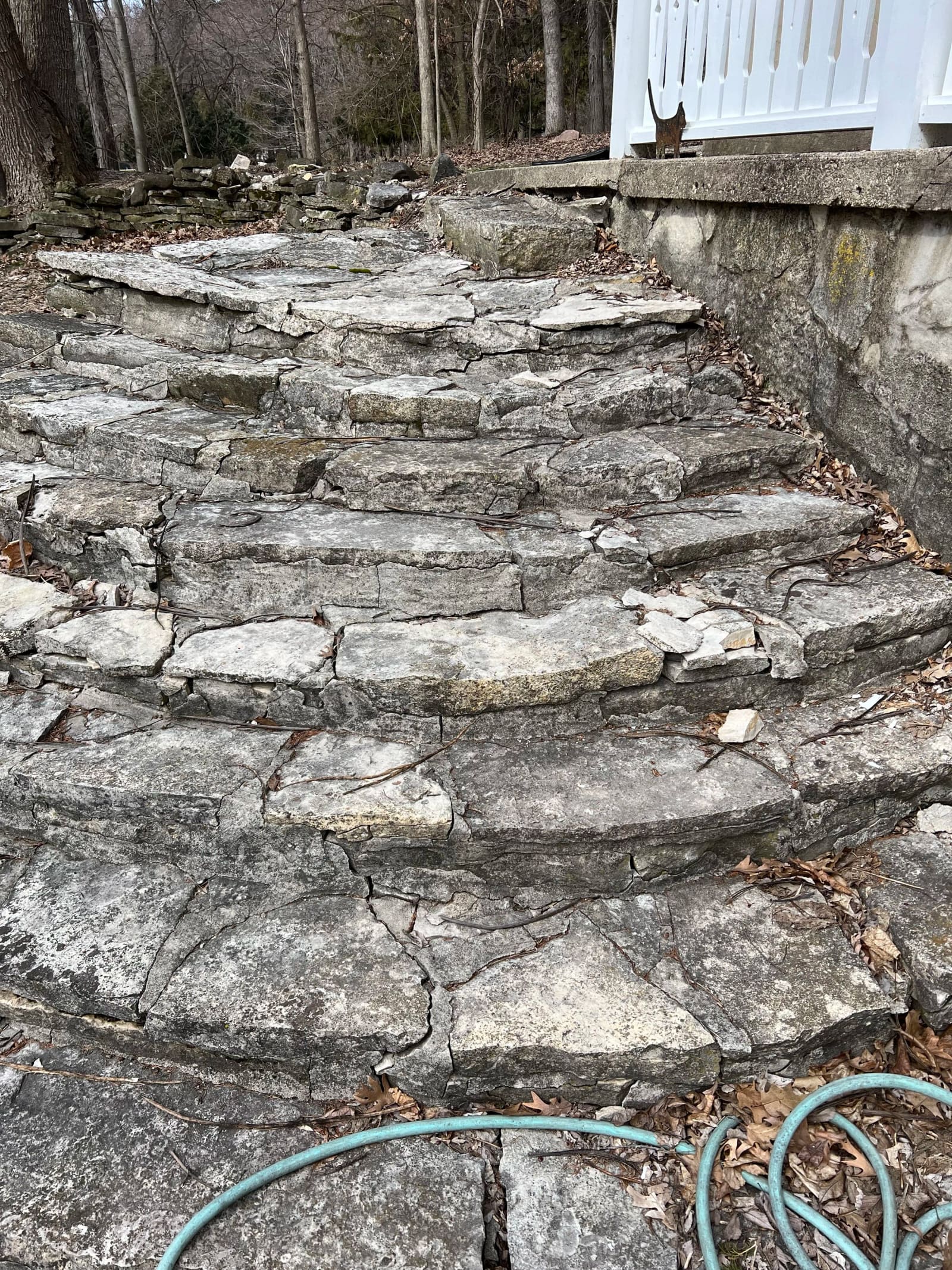 Before: Pewaukee lake house — every stone in the old steps was loose. Rebuilt from the footing up.