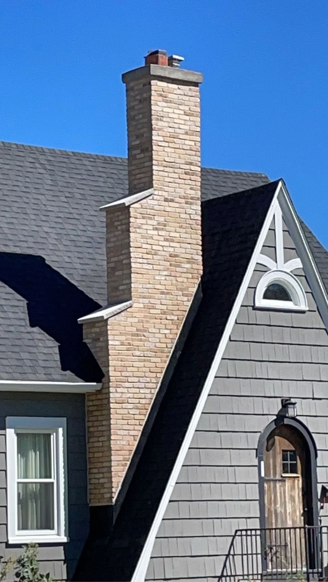 After: Old chimney with failing stone veneer — re-wrapped in thin brick for a clean, modern look.