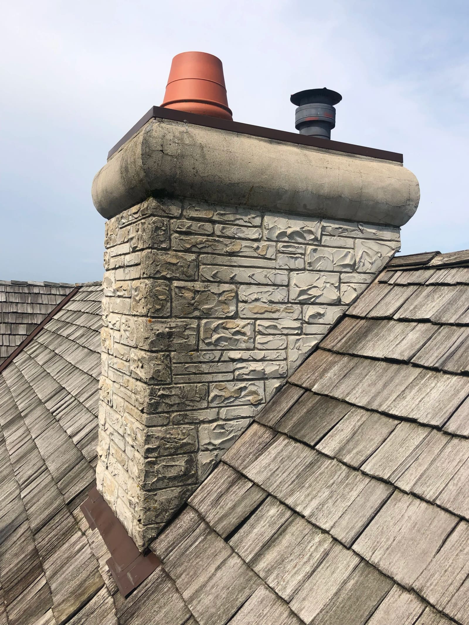 Before: Chimney was causing water damage inside the home — rebuilt with correct flashing to stop the leak for good.